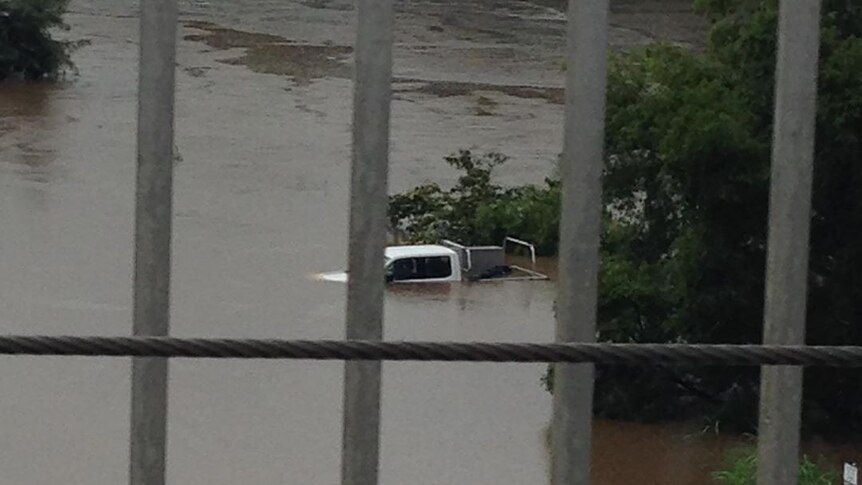 Car almost fully underwater