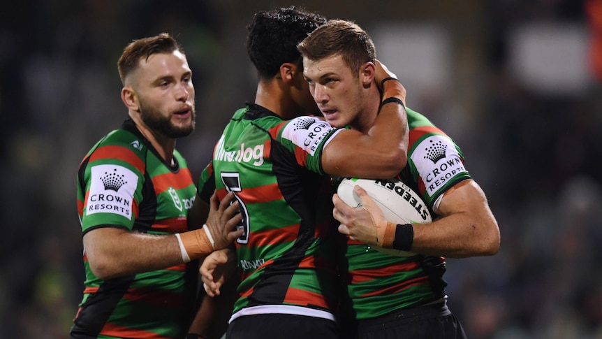Rabbitohs celebrate a try against Raiders