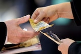 generic money donation woman hands over cash to man thumbnail