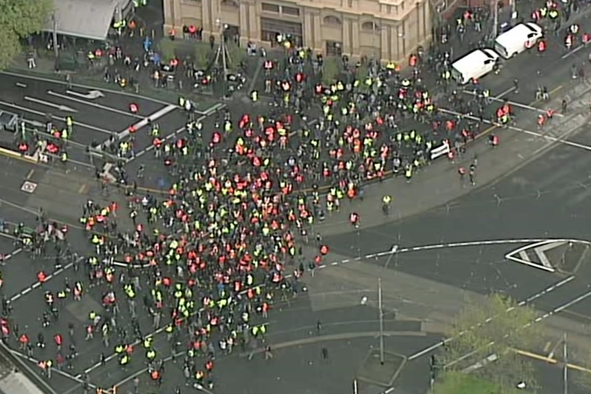 An aerial shot of people wearing high-vis clothing.