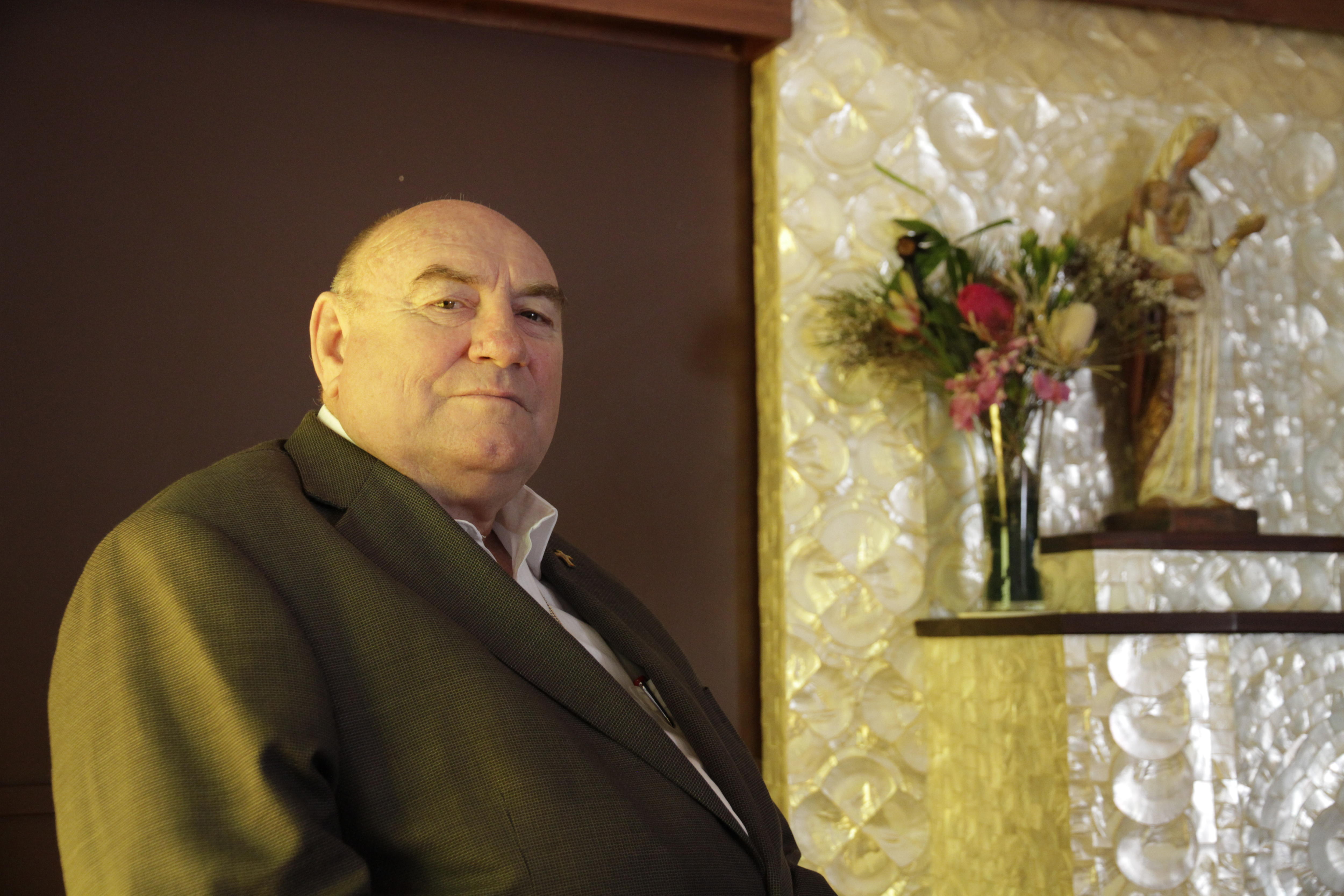 bishop christopher saunders seated by altar