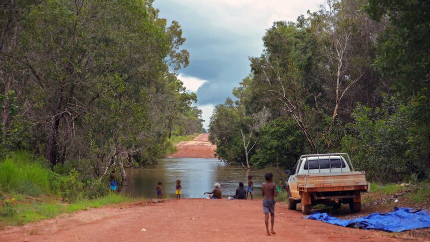 Women and children fish at Coopers Creek.