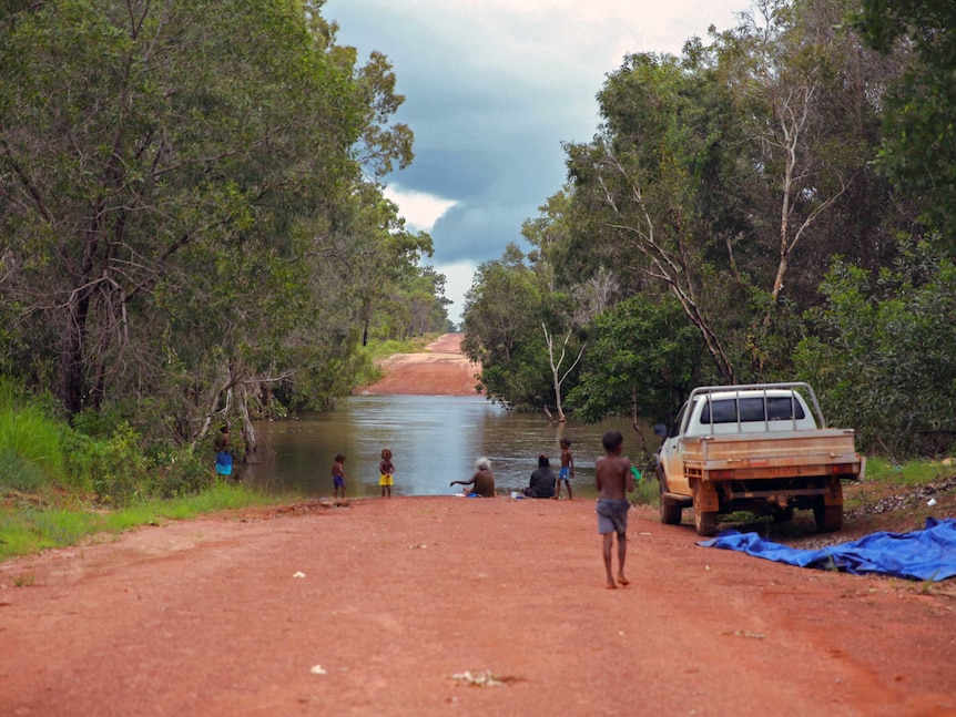 Women and children fish at Coopers Creek.