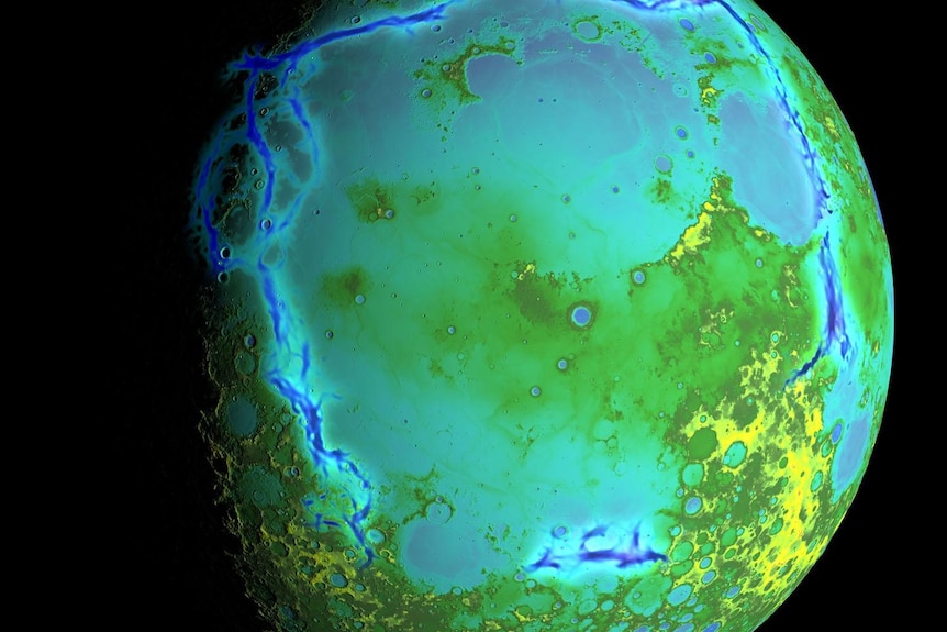A moon with blue, green and yellow showing topography
