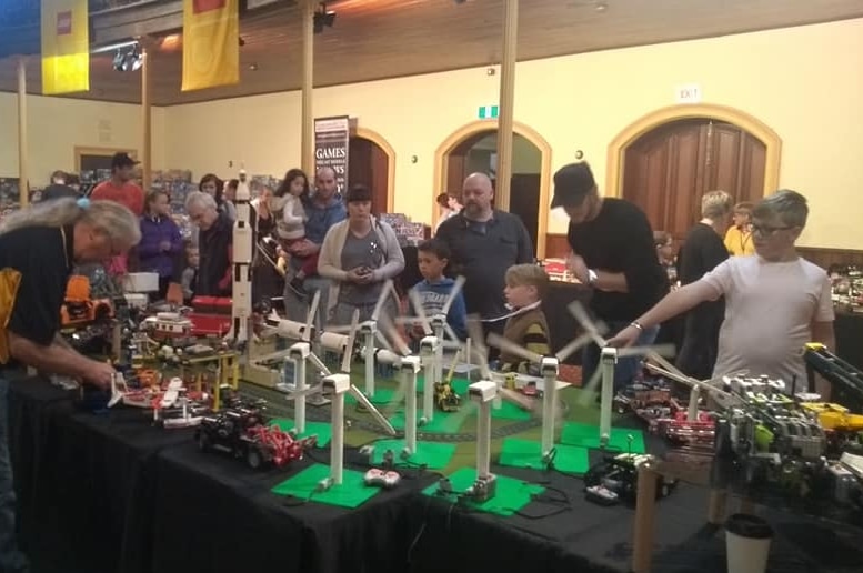 A crowd looks at Lego creations.