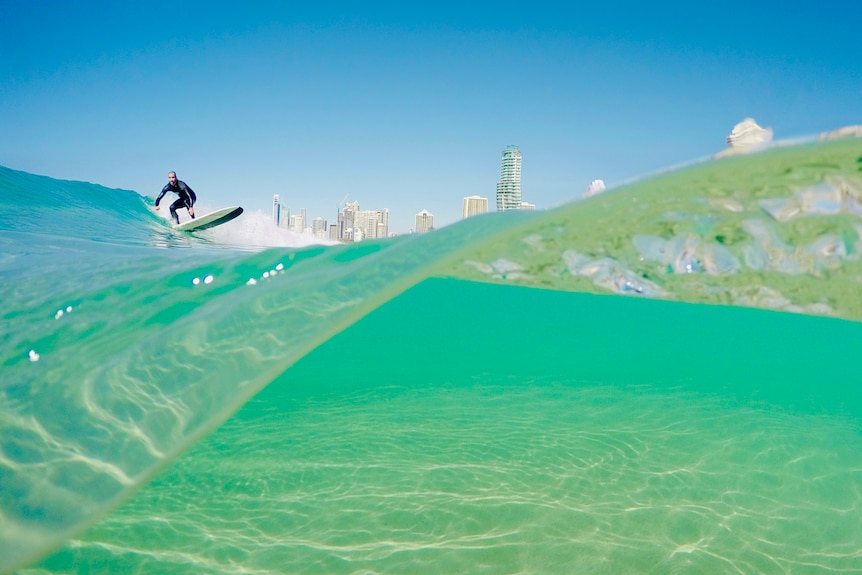 Underwater shot of man surfing on Gold Coast.