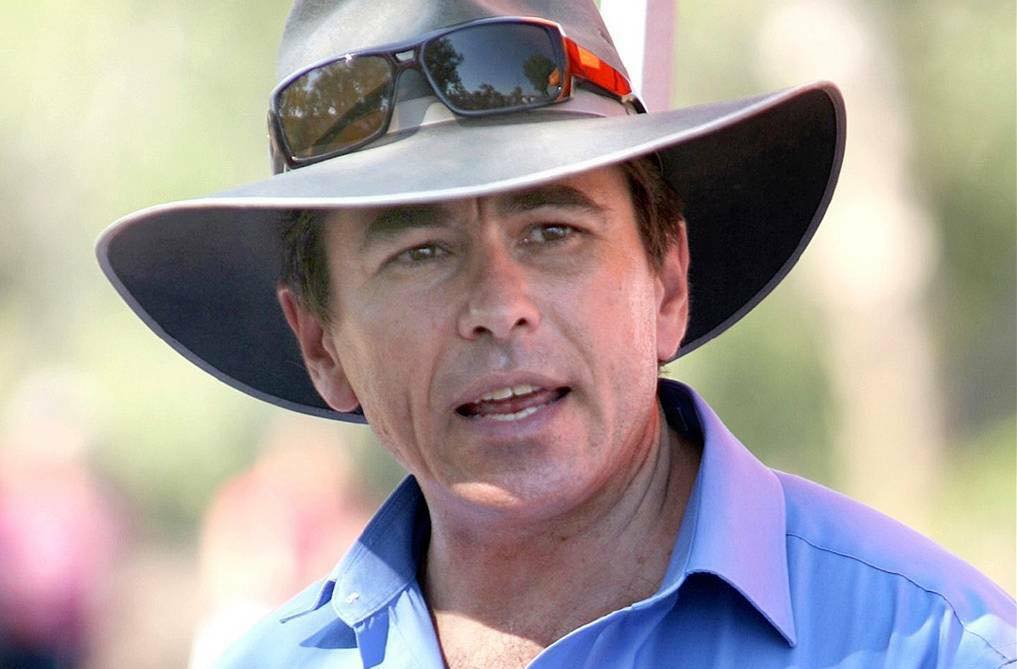 a man wearing a wide-brimmed hat. 