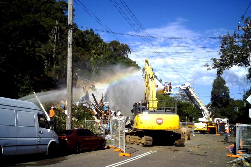 Engineers demolish a house at Narrabeen that was severely damaged in the NSW storm