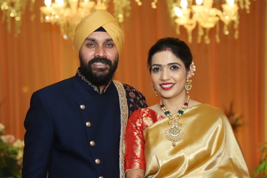 an indian man and woman on their wedding day