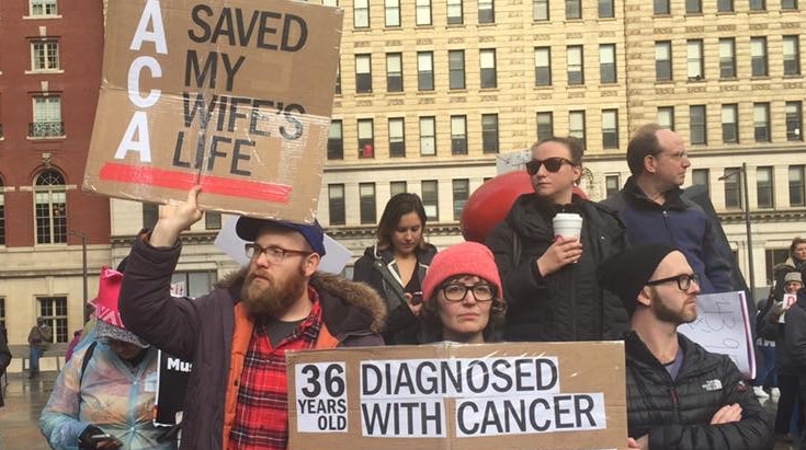 Sarah Pulver and her husband, Chris Lawrence, protesting in Philadelphia against the repeal of the Affordable Care Act