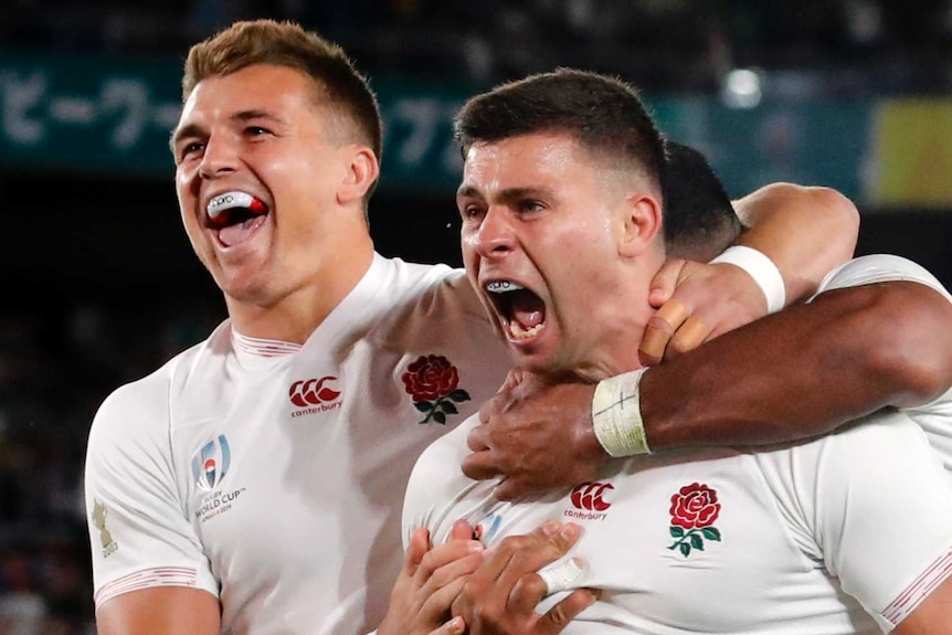 England players hug Ben Youngs, who is screaming, after scoring what he thought was a try in the Rugby World Cup semi-final.