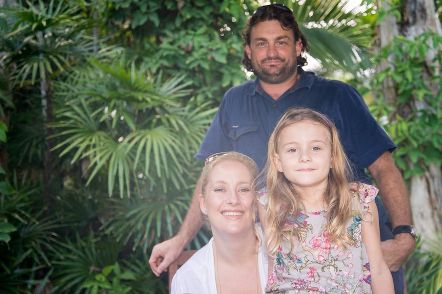 A family portrait of Alex, Glen and Charlotte Crichton five years after Alex gave birth to Charlotte in a makeshift hospital.