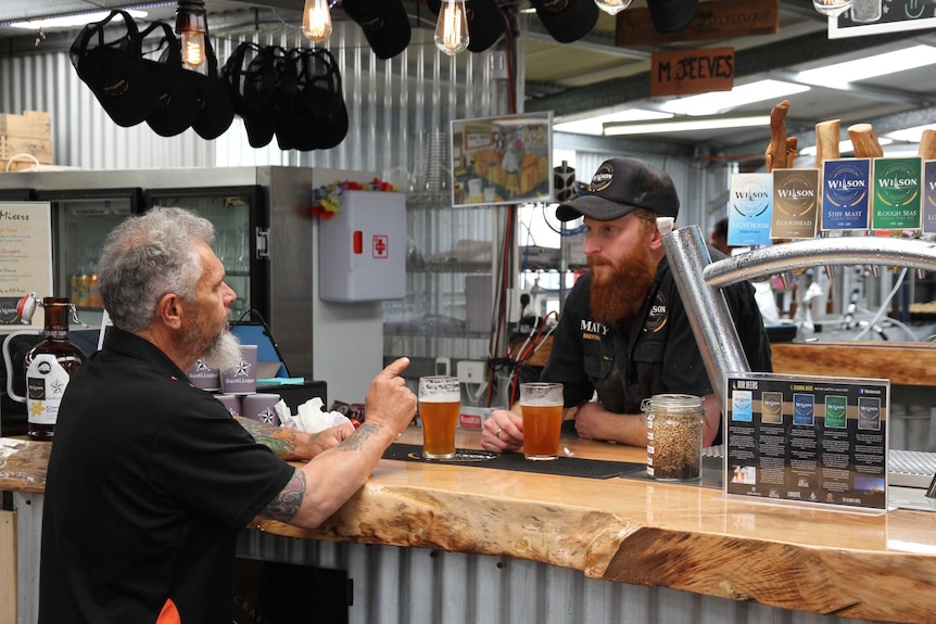 Harvester Joey Williams orders a quandong beer in a rural WA pub