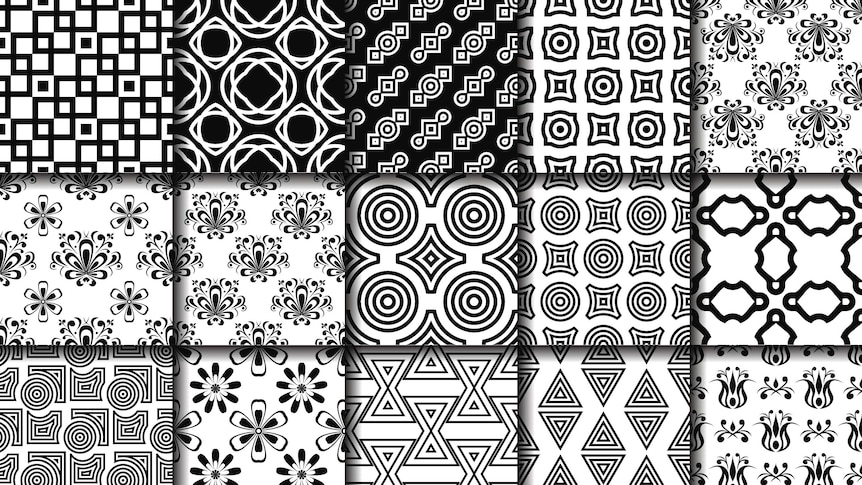 A series of white tiles with different black geometric line designs on them