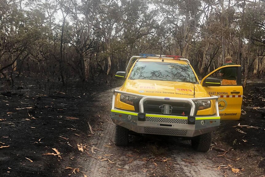 Rural Fire Service vehicle on burnt-out sand track from a bushfire on Fraser Island off south-east Queensland.