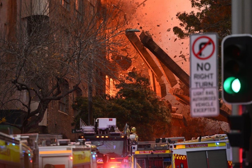 A wall collapses during a building fire in the Central Business District of Sydney