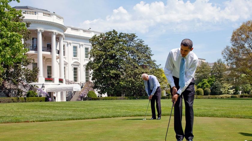 President Barack Obama and Vice President Joe Biden practise their putting