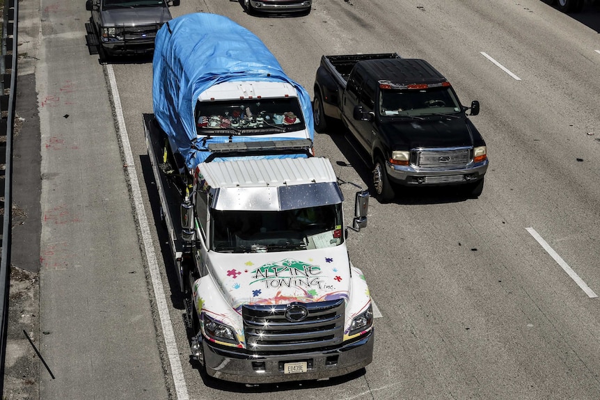 Cesar Sayoc's van is transported on a flatbed tow truck.