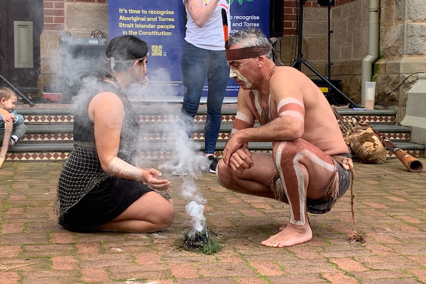 Jakirah Telfer and father Karl perform a welcome to country outside Adelaide's Carclew building