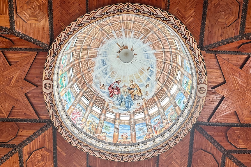 The inside of the dome of the Immaculate Conception Cathedral showing Mary being crowned by Jesus, and Samoan figures beneath.