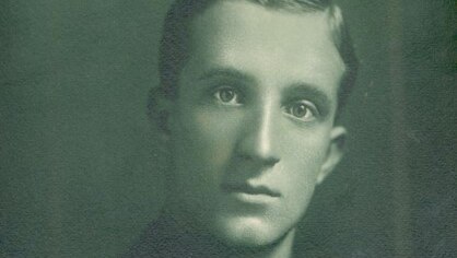 Old monochrome formal portrait of Arthur Long in military uniform.