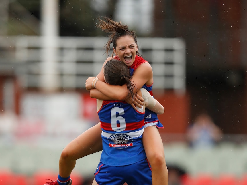 Monique Conti celebrates wildly with a Bulldogs teammate