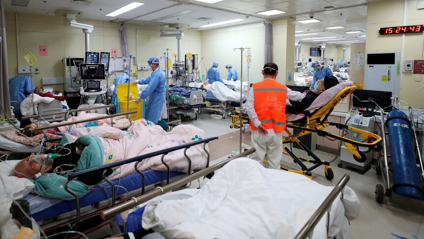Medical workers attend to patients at the intensive care unit of the emergency department at Beijing Chaoyang hospital 