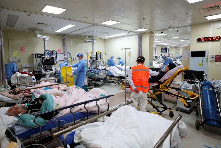 Medical workers attend to patients at the intensive care unit of the emergency department at Beijing Chaoyang hospital 