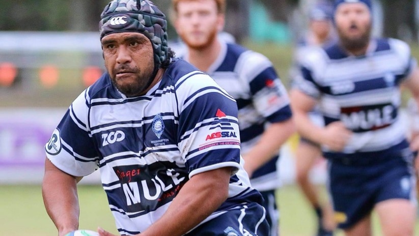 NRL legend Masada Iosefa tosses a ball while playing rugby with the Rockhampton Brothers Rugby Club