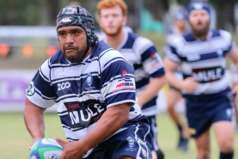 NRL legend Masada Iosefa tosses a ball while playing rugby with the Rockhampton Brothers Rugby Club