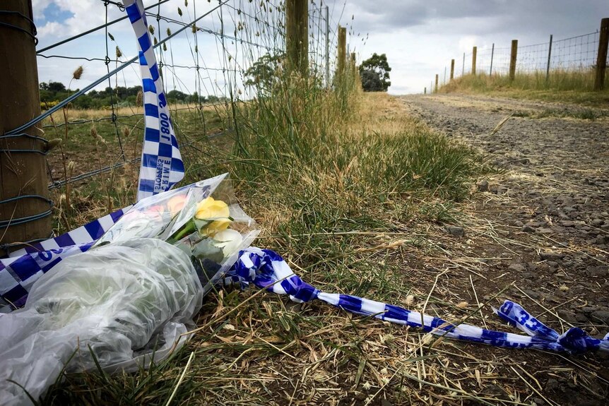 Flowers were left at a property in Kyneton where a woman was found dead.