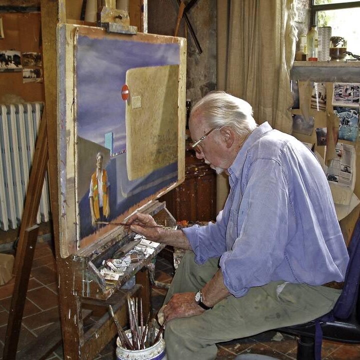 Jeffrey Smart paints in his studio.