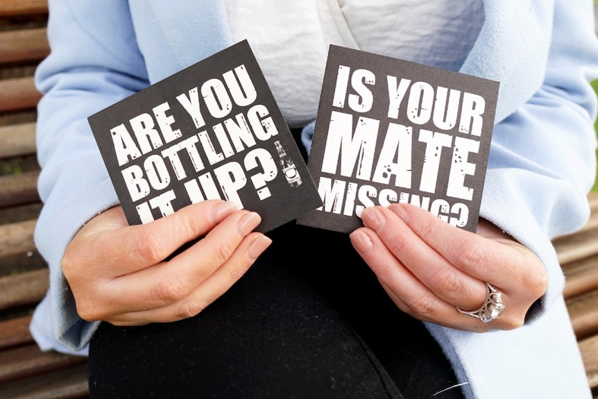 Two black coasters with the words 'Are you bottling it up?' and 'Is your mate missing?'