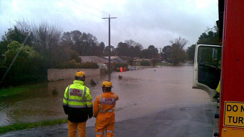 CFA responds: emergency workers rescue an elderly man from his flooded home near Calembeen Park