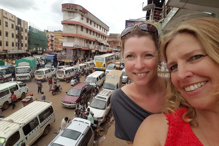 Diane Squires and her sister take a selfie in Africa with streets below