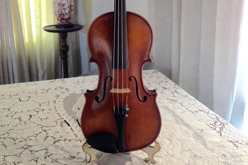Joyce Vanderveen's violin pictured; it has strong red colouring.