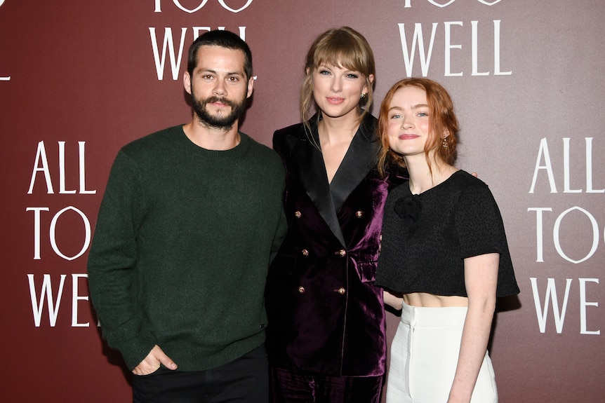 Dylan O'Brien, Taylor Swift and Sadie Sink smile for the camera.