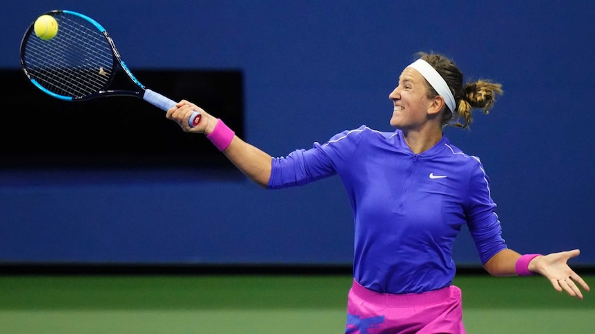 Victoria Azarenka grimaces as she hits a single-handed forehand