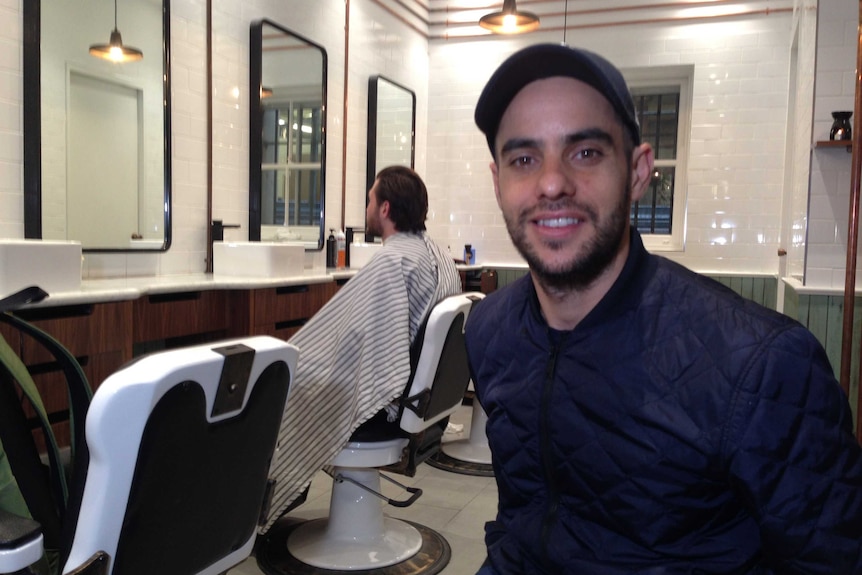 Frank Bazzano in men's barber shop AlphaBarbers.