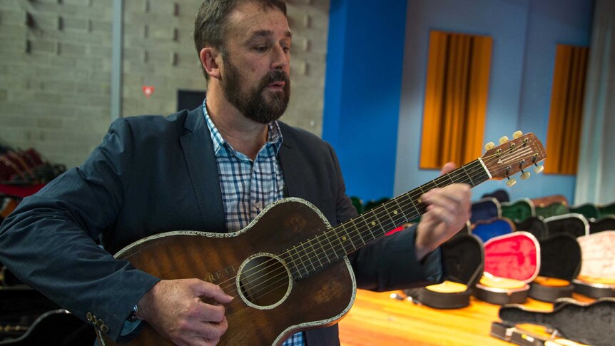 Dr Glen Hodges plays a 1920s Hammond guitar