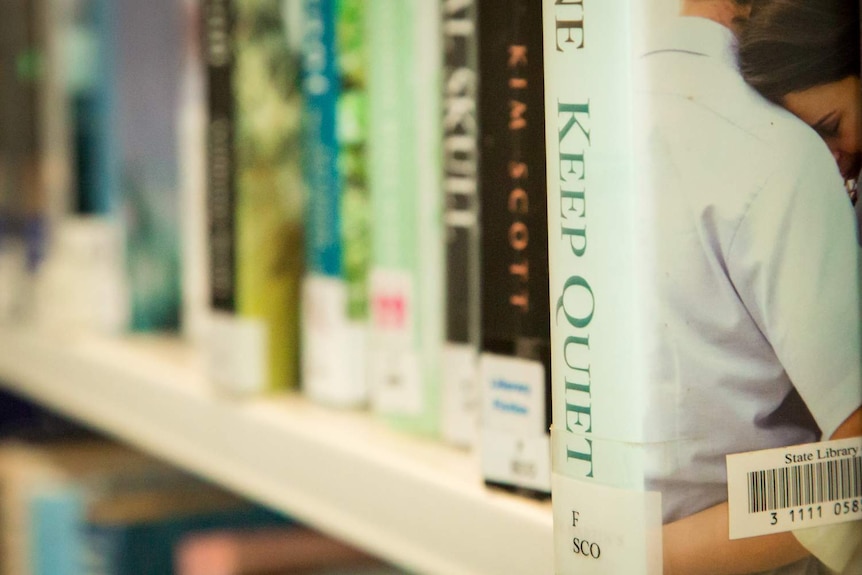 This picture shows a shelf full of books with one title "Keep Quiet" in the foreground.