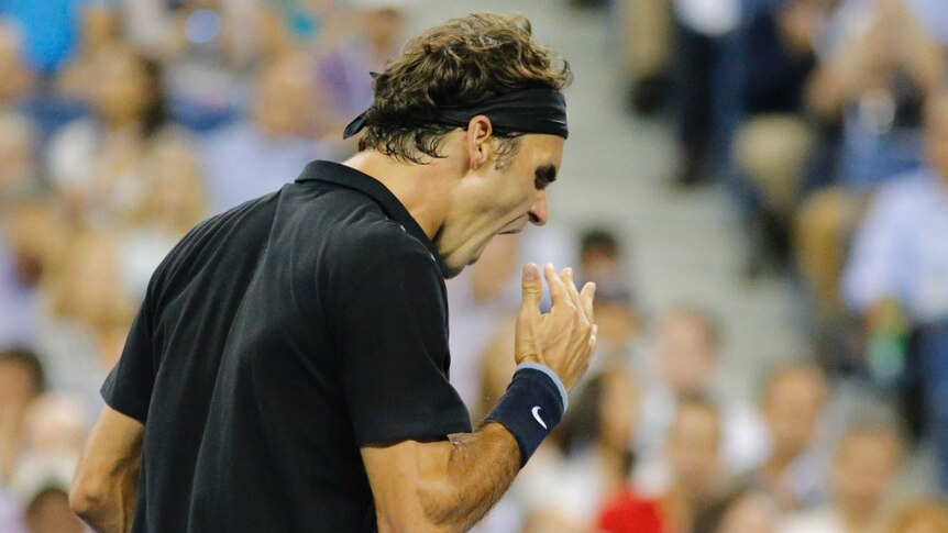 Roger Federer reacts during his US Open quarter-final