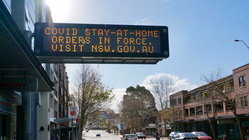 An electronic sign reminding motorists of the COVID-19 lockdown orders in Sydney.