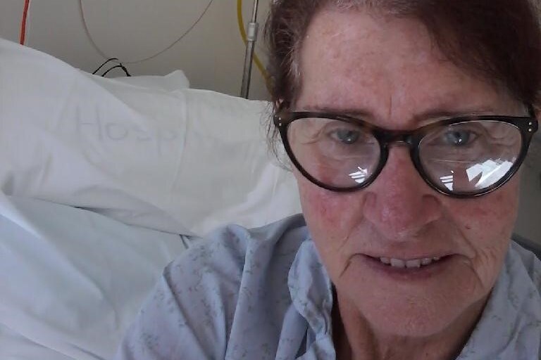Kathleen Watson sitting on hospital bed