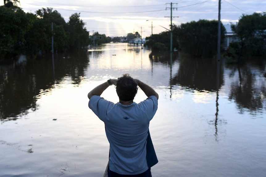 Residents watch the flood waters in Lismore, New South Wales, Friday, March 31, 2017.