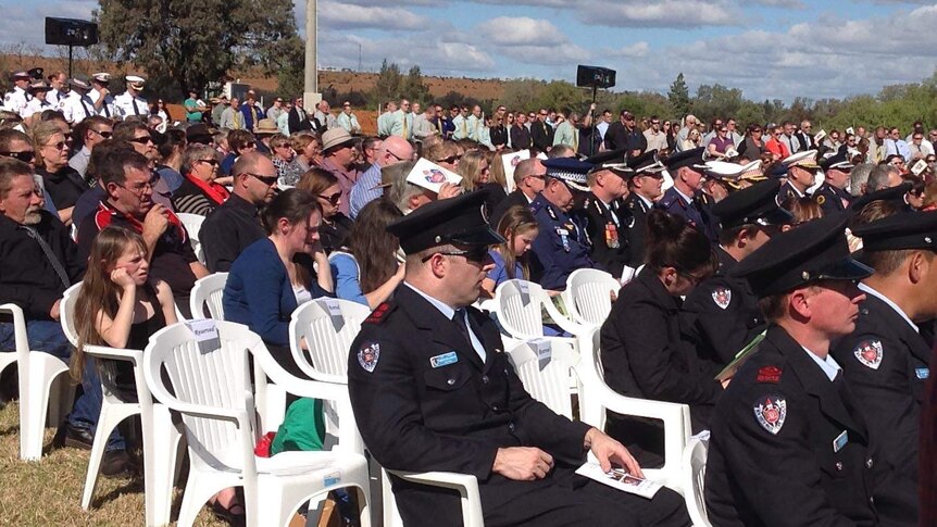 Mourners seated at firefighter Daniel Howard's funeral