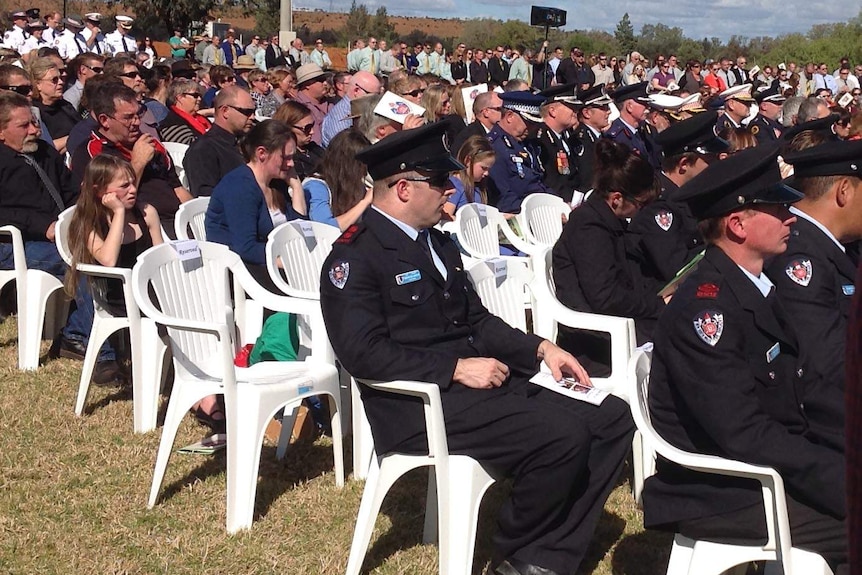 Mourners seated at firefighter Daniel Howard's funeral