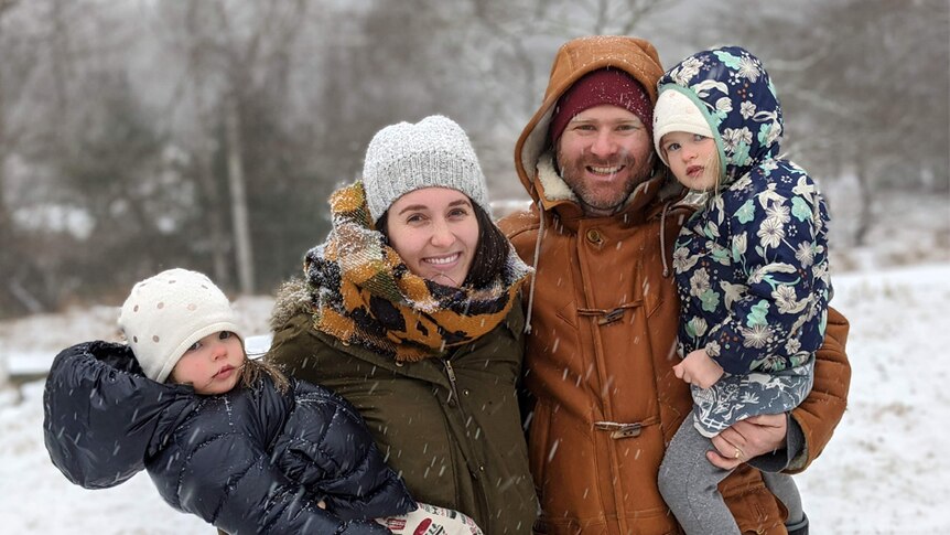 ED Coper with his wife and two daughters in the snow in New York