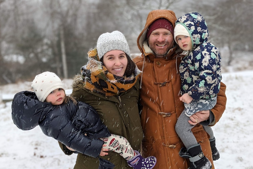 ED Coper with his wife and two daughters in the snow in New York