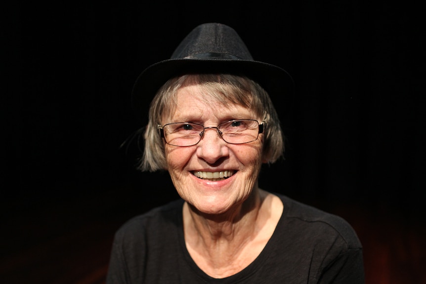 A close-up shot of Inge Truckenbrodt smiling.